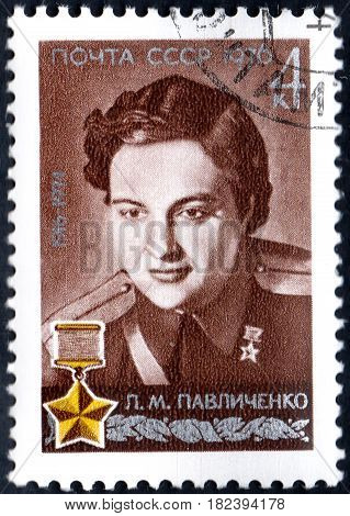 UKRAINE - CIRCA 2017: A postage stamp printed in USSR shows Portrait of Hero of USSR Pavlichenko with inscription 60th Birth Anniversary of L.M.Pavlichenko circa 1976