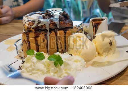 honey toast with vanilla ice-cream and chocolate on plate - sweet dessert