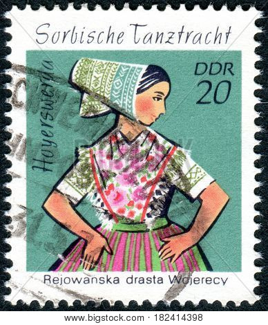 GERMANY - CIRCA 1971: A stamp printed in Germany (GDR) shows the Sorbian Dance Costumes from Hoyerswerda circa 1971