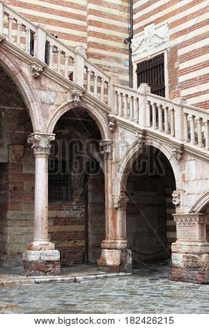 Staircase of reason in courtyard the Palazzo della Ragione. Verona, Italy