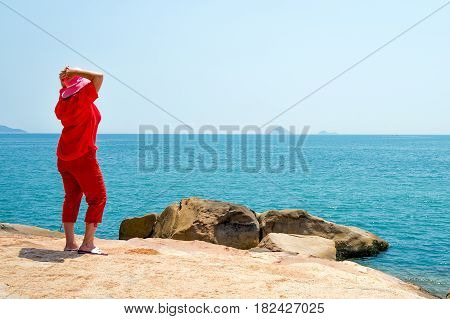 Woman looking at the sea. Garden Visit Hon Chong rocks come in all sightseeing tours in Nha Trang, Vietnam