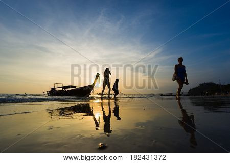 Ao Nang Krabi Thailand - March 03 2017: People on the Ao Nang beach at sunset in Krabi province Thailand