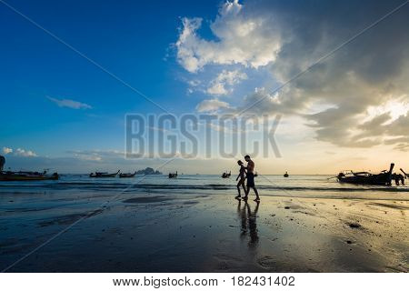 Ao Nang Krabi Thailand - March 02 2017: People on the Ao Nang beach at sunset in Krabi province Thailand
