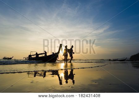 Ao Nang Krabi Thailand - March 03 2017: People on the Ao Nang beach at sunset in Krabi province Thailand