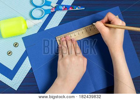Making greeting card for Father's Day. Children's art project. DIY concept. Step-by-step photo instruction. Step 2. Child makes card layout
