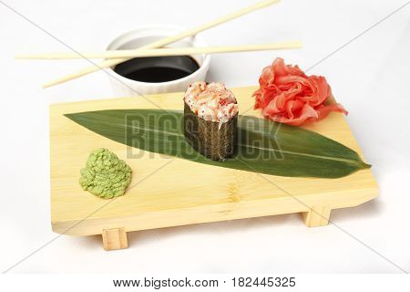 Japanese poppies with eel, salmon, flying fish roe, shrimp and ginger isolated on white background