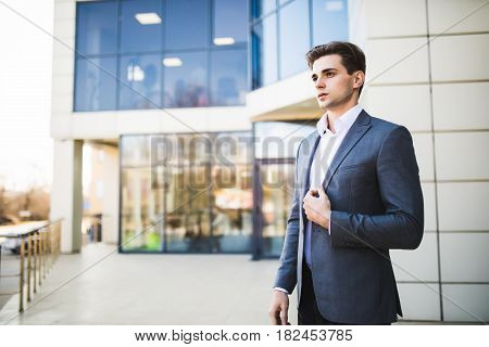Handsome Business Man Outdoors In Front Of Office Building