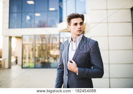 Successful Business Man Outdoors In Front Of Office Building Wait For Parnters