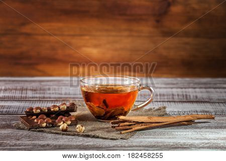 orange-pekoe chocolate and thin captain on a wooden table