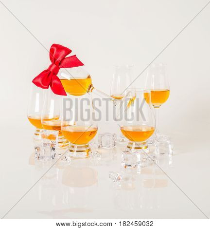 Set Of Single Malt Tasting Glasses, Single Malt Whisky In A Glasses, White Background, Red Bow