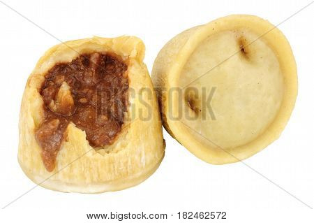 Two steamed steak and kidney puddings isolated on a white background