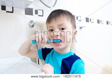 child portrait brushing teeth boy dental care oral hygiene concept child in bathroom with tooth brush, healthy lifestyle