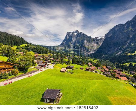 Colorful morning view of Grindelwald village valley from cableway. Wellhorn mountain located west of Innertkirchen in the Bernese Oberland Alps. Switzerland Europe.