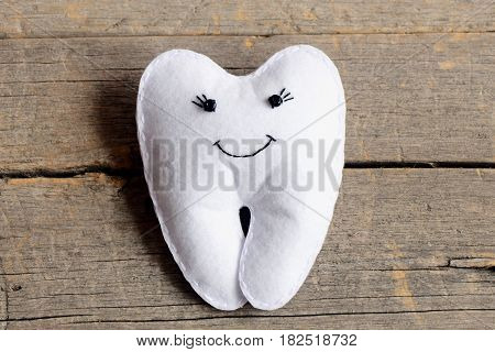 How to sew a felt tooth fairy. Step. Tutorial for children. Handmade cute felt tooth fairy isolated on old wooden background. Simple and fun sewing project for children. Top view