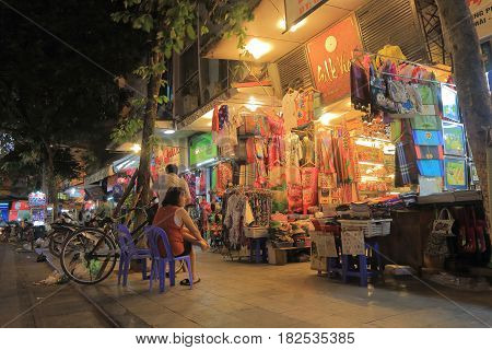 HANOI VIETNAM - NOVEMBER 22, 2016: Unidentified people visit Hang Gai Silk street. Hang Gai Silk street is famous for silk shopping.