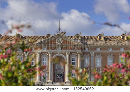Caserta, Italy, May 1, 2016: Caserta Palace Royal Garden.Detail of main facade: it is a former royal residence in Caserta constructed for the Bourbon kings of Naples.