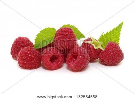 Raspberry with leaves isolated on white background.