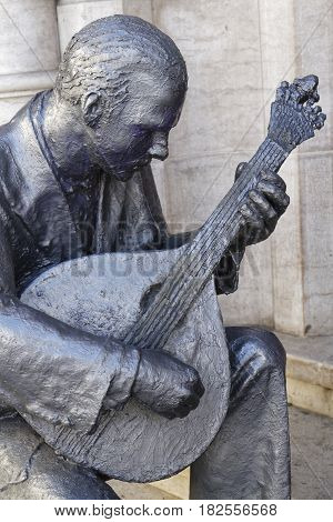 Lisbon, Portugal, April 8, 2017 : Sculpture Of Fado Musician And Dancer In Rossio Station.  In Popul