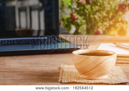 Coffee Cup And Notebook On Wood Table