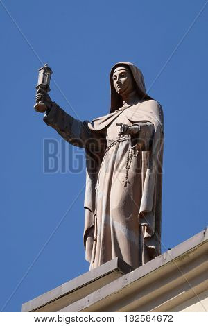 SHKODER, ALBANIA - SEPTEMBER 30: Saint Clare of Assisi statue on St Stephen's Cathedral in Shkoder, Albania on September 30, 2016.