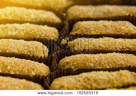 Stacked short pastry potato cookies on blue table
