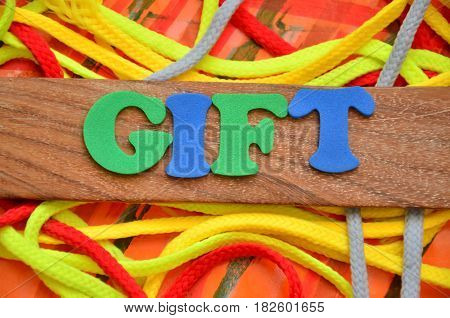 WORD GIFT  ON A  ABSTRACT COLORFUL BACKGROUND