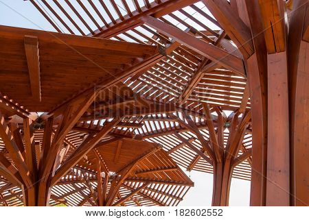 Wooden canopy for protection against the sun, through wooden sunshade see the sky