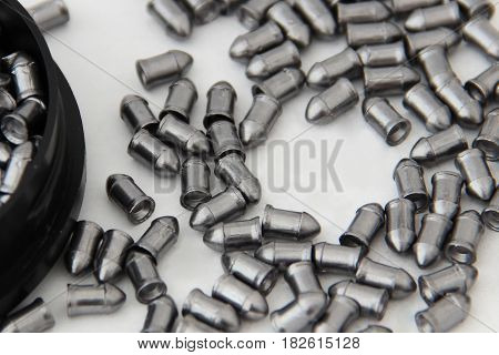 Bullets From The Gun Placed On Light Baskground With Blank Space Place For Inscription