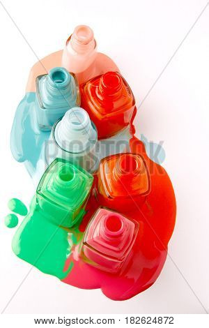 Nails varnish bottles on white background. Colorful