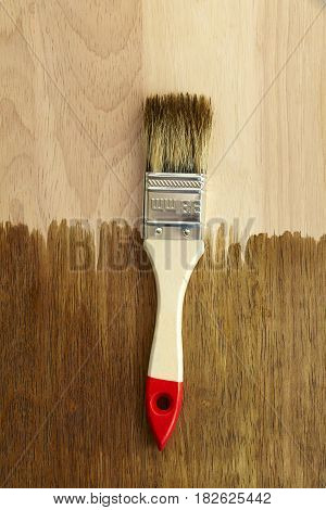 White brush on wooden background. hardwood tool