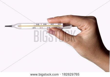 Thermometer in a woman hand isolated on white background. Temperature measuring by a thermometer.
