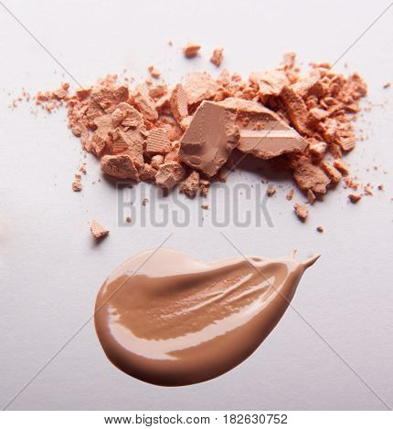 Сrumbled natural powder make up on white background. Face powder texture