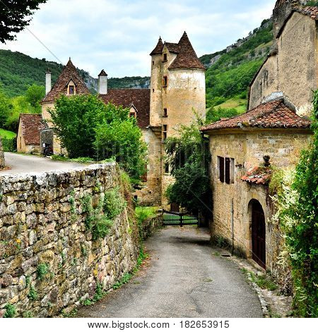 Pretty Lane Through The Stone Houses Of The Village Of Autoire, France