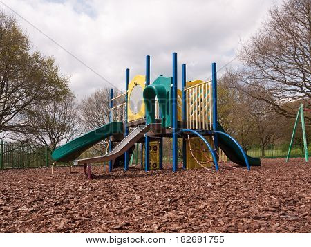A Childrens Playground Cimbing Frame Multicolored And With Various Slides For Fun And Games On Wood