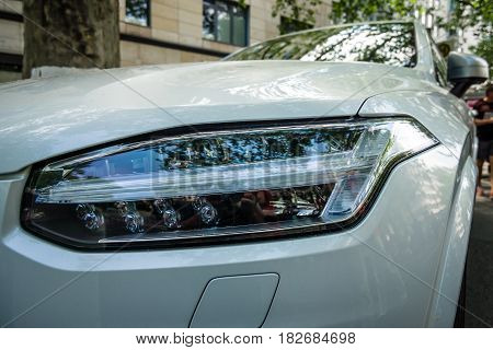 BERLIN - JUNE 05 2016: Headlamp of mid-size luxury crossover SUV Volvo XC90. Classic Days Berlin 2016.