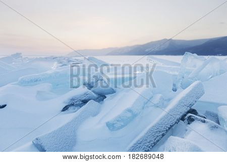 Turquoise Ice Floes. Winter Sunset Landscape.