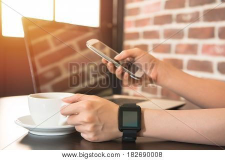 Woman Working At Laptop With Coffee