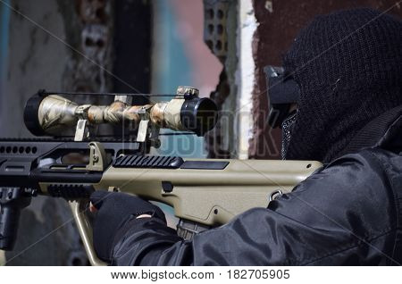 Special forces soldier aim target with sub machine gun