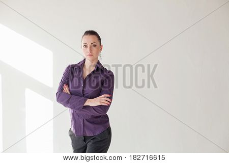 Working girl is standing in a white room