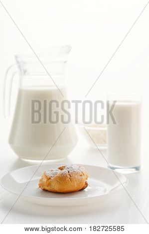 Eclair Cake In A Plate, With Milk In A Glass And Jug, Cottage Cheese In A Bowl In The Background, On