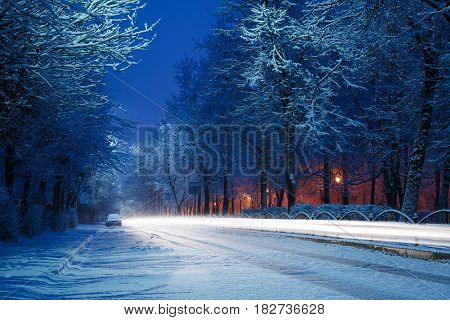 spring winter road at sunrise with light from cars long exposure