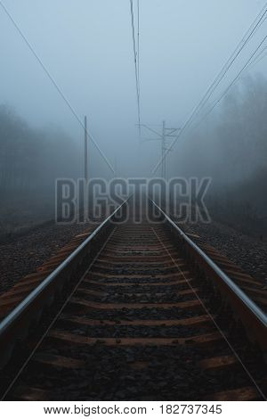 railway to horizon in the deep fog