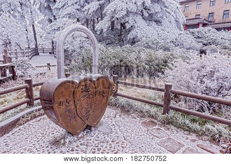 Huangshan mountain China - December 27 2016: Giant lock - symbol of love and wedding by the hotel.