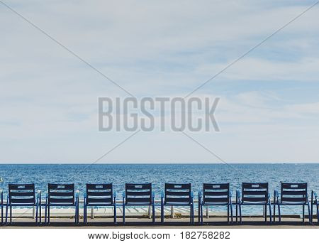 Promenade Des Anglais Seaside In Nice With Blue Chairs
