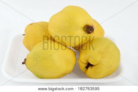 Large ripe yellow quince isolated on white backgrounds