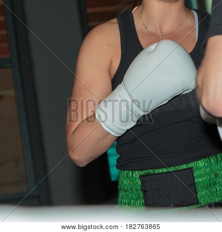Pugilist Girl At Boxing Training In The Ring With Sparring Partner
