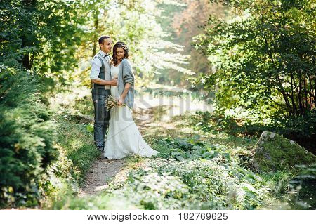 Happy Couple Walking In Summer Park