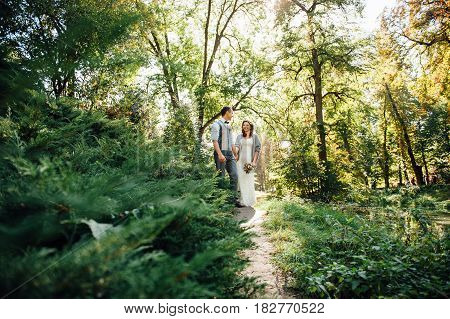 Happy Couple Walking In Summer Park