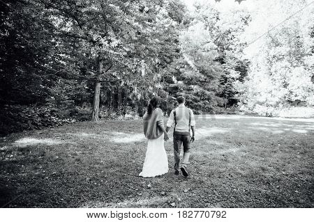 Happy Couple Walking In Summer Park