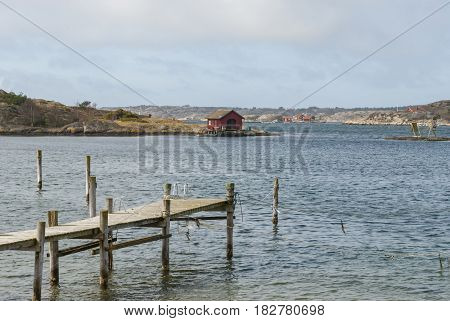 Wooden pier in Tanumsstrand in Sweden in spring